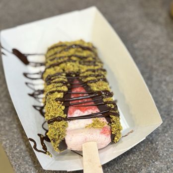 The Paleta bar - Chandler - Strawberry Cheesecake Paleta dipped in Dark Chocolate and topped with Pistachios. - Ice Cream & Frozen Yogurt Near Me - Chandler, Arizona
