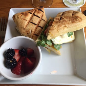 Backstreet Cafe - Fried egg sandwich with ONE piece of bacon and a half full bowl of fruit. It's brunch. Don't be skimpy - New American Near Me - Houston, Texas