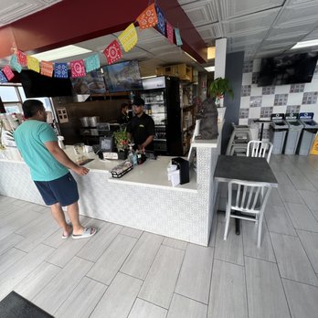 Tacos El Jalisciense - a woman ordering food - Mexican Near Me - Seaside, California Tacos El Jalisciense - a woman ordering food - Mexican Near Me - Seaside, California