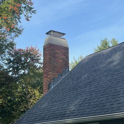 Minuteman Chimney Sweeps - After Repair - looks much better! Chimney crown was previously cracked and there was moss on the sides of the chimney.