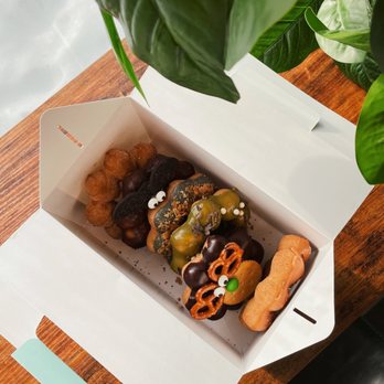 Tring5 - a box of doughnuts on a table - Desserts Near Me - Winnipeg, Manitoba Tring5 - a box of doughnuts on a table - Desserts Near Me - Winnipeg, Manitoba
