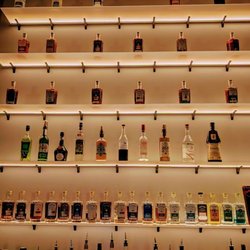 Sideshow Spirits - The lighted wall featuring their spirits keeps you captivated and adds greatly to the speakeasy vibe.