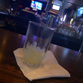 Holiday Lounge - a drink in a glass on a napkin - Lounges Near Me - Omaha, Nebraska
