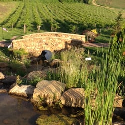 Cottage Winery and Vineyard - Charming stone bridge with rolling vineyard in back drop