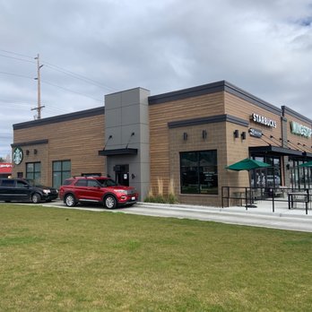 Starbucks - a red car parked in front of a coffee shop - Coffee & Tea Near Me - Oak Harbor, Washington
