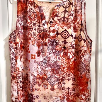 Thrift Shop - Who says that a pinky-orangy coloured sleeveless poly-T can't be charming? - Thrift Stores Near Me - Carleton Place, Ontario