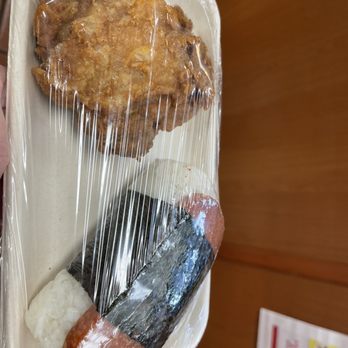 Minit Stop - a person holding a plastic container with food in it - Convenience Stores Near Me - Paia, Hawaii Minit Stop - a person holding a plastic container with food in it - Convenience Stores Near Me - Paia, Hawaii