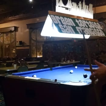 Green Tortoise Hostel - International room playing some pool - Hostels Near Me - San Francisco, California