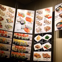 a variety of sushi dishes on display a variety of sushi dishes on display