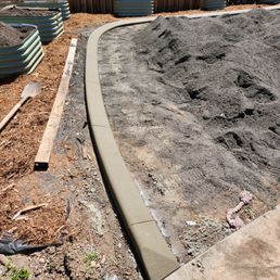 a garden with dirt and gravel