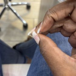 Canton Nail Salon - Under nail not covered by correct size tip .