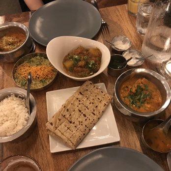 Ghee Indian Kitchen - Our curry spread! Upper left: tikka nasal, green is Miller, middle is eggplant, bottom right is lamb. Middle features a roti. - Indian Near Me - Miami, Florida Ghee Indian Kitchen - Our curry spread! Upper left: tikka nasal, green is Miller, middle is eggplant, bottom right is lamb. Middle features a roti. - Indian Near Me - Miami, Florida