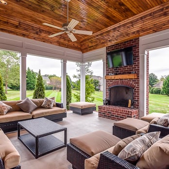 Broderick Builders - a covered patio with a fireplace - General Contractors Near Me - Nashville, Tennessee Broderick Builders - a covered patio with a fireplace - General Contractors Near Me - Nashville, Tennessee