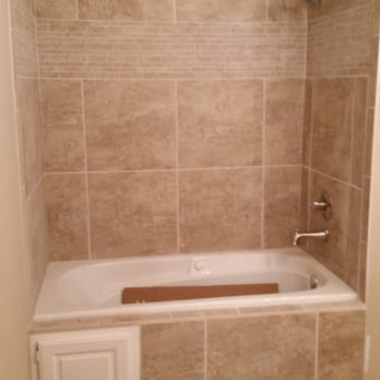 Carpet Cabin - a bathtub and shower in a bathroom - Carpeting Near Me - Fort Smith, Arkansas Carpet Cabin - a bathtub and shower in a bathroom - Carpeting Near Me - Fort Smith, Arkansas