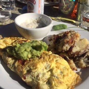 Cody's La Jolla - Bacon & Cheddar omelette, potatoes, and grits. - Breakfast & Brunch Near Me - La Jolla, California Cody's La Jolla - Bacon & Cheddar omelette, potatoes, and grits. - Breakfast & Brunch Near Me - La Jolla, California