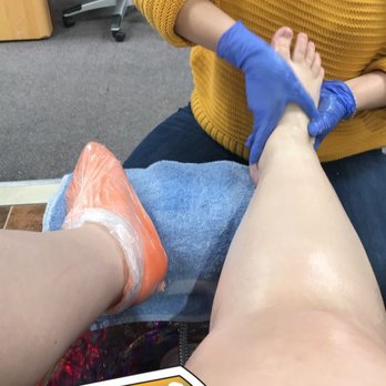 Miya's Nails - The orange thing on my foot is the paraffin was treatment. $7 extra but so so worth it! - Nail Salons Near Me - Clive, Iowa Miya's Nails - The orange thing on my foot is the paraffin was treatment. $7 extra but so so worth it! - Nail Salons Near Me - Clive, Iowa