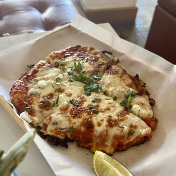 Lemon Drop - They finally have food! :) This is the tikka masala flatbread. - Lounges Near Me - Alameda, California