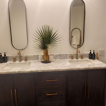 MJ Construction - a bathroom with two sinks and mirrors - General Contractors Near Me MJ Construction - a bathroom with two sinks and mirrors - General Contractors Near Me