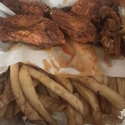6 piece wings with fries, ate one before the picture 6 piece wings with fries, ate one before the picture