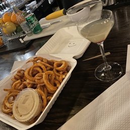 Curly fries with cheese sauce Curly fries with cheese sauce