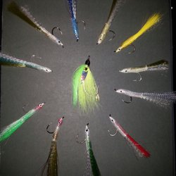 Dinner of our fluke and bass candy lures abd a nice tuna fly in the middle.