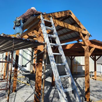 Badasski Construction - a man on a ladder working on a roof - General Contractors Near Me - Magna, Utah Badasski Construction - a man on a ladder working on a roof - General Contractors Near Me - Magna, Utah