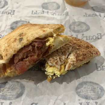 Sunrise Bread Company - Spicy breakfast sandwich with bacon, egg, and cheese.  Sesame bagel with turkey sausage, egg, and cheddar cheese. - Coffee & Tea Near Me - Titusville, Florida