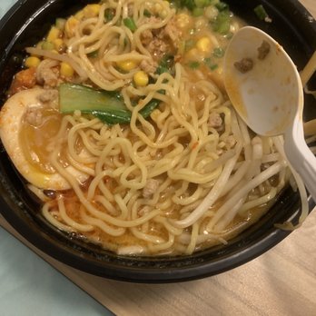 Ramen Takagi - Spicy miso ramen to-go plus added egg (messy bowl because I already started diggin in lol) - Japanese Near Me - Oviedo, Florida Ramen Takagi - Spicy miso ramen to-go plus added egg (messy bowl because I already started diggin in lol) - Japanese Near Me - Oviedo, Florida