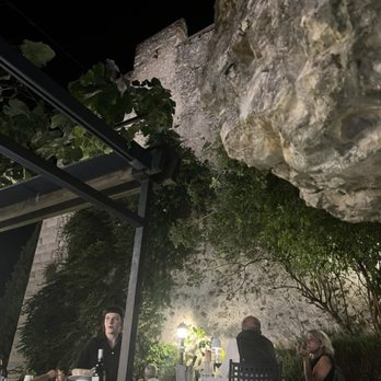 Paradiso Perduto - Tables under the wall of the Castello di Malcensia at Paradiso Perduto - Italian Near Me - Malcesine, VR