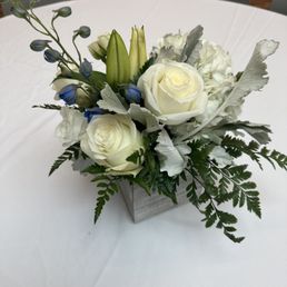 Arrangement for a 5ft round table; white flowers with blue accent; Business Brunch decor