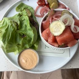 Burger no bun with watermelon and pickle salad. Burger no bun with watermelon and pickle salad.