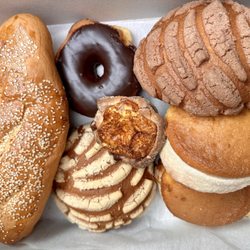 Cristino's Bakery - Breakfast of champions! Jalapeo Bolillo, dona chocolate, Vanilla Concha, Chocolate Concha and Bullseye
