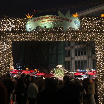 Weihnachtsmarkt Am Heumarkt - Entrance to the Weihnachtsmarkt, to the right of the Cathedral and in the shadows of the twin spires - Christmas Markets Near Me - Cologne, NW