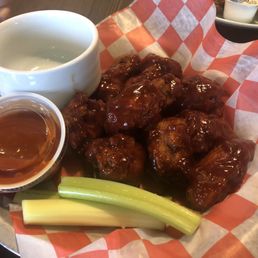 Bbq wings with a side of Buffalo Sauce.