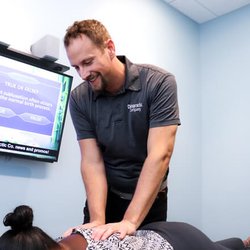 Chiropractic Company of Mequon - Dr. John Staranko giving a back adjustment