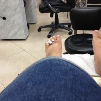 C T Nails - Toilet paper for toe spacers.  The roll resides on their filthy floor. - Nail Salons Near Me - North Miami, Florida