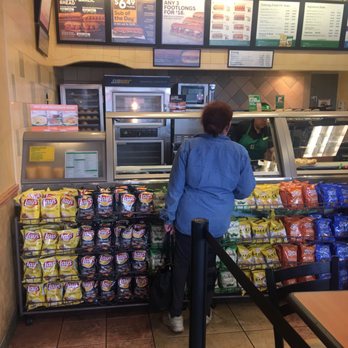 Subway - a woman standing in front of a display of food - Sandwiches Near Me - La Puente, California Subway - a woman standing in front of a display of food - Sandwiches Near Me - La Puente, California