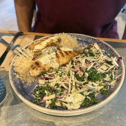 Wild Rockfish with garlic butter sauce the sides are white rice & kale slaw Wild Rockfish with garlic butter sauce the sides are white rice & kale slaw