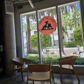 JOE & THE JUICE - Interior of the restaurant with a view of the outdoor seating. - Juice Bars & Smoothies Near Me - Miami Beach, Florida