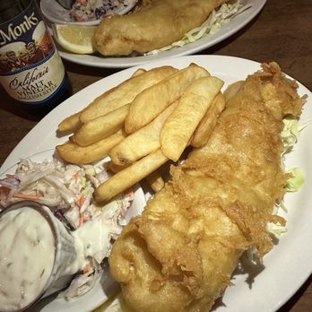 London Bridge Pub - Fish and chips plate with coleslaw, can't forget about the malt vinegar and lemon squeeze. - British Near Me - Monterey, California London Bridge Pub - Fish and chips plate with coleslaw, can't forget about the malt vinegar and lemon squeeze. - British Near Me - Monterey, California