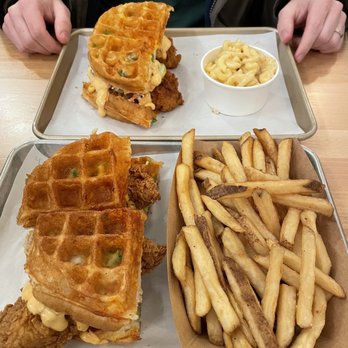 Namkeen - Front: Naked waffle sandwich with no coleslaw or pickles, fries. Back: Mild waffle sandwich with all the fixin's, mac and cheese. - Chicken Shop Near Me - Chatham, New Jersey Namkeen - Front: Naked waffle sandwich with no coleslaw or pickles, fries. Back: Mild waffle sandwich with all the fixin's, mac and cheese. - Chicken Shop Near Me - Chatham, New Jersey