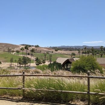 Watering Hole - Walkway leading up to the Watering Hole restaurant overlooking the African safari. - American Near Me - Escondido, California