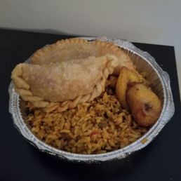 Shrimp empanada, sweet plantains and rice with pidgeon peas. Shrimp empanada, sweet plantains and rice with pidgeon peas.