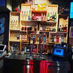 The By-Pass Bar & Grill - We only carry the best spirits and we love to show off our rustic back bar