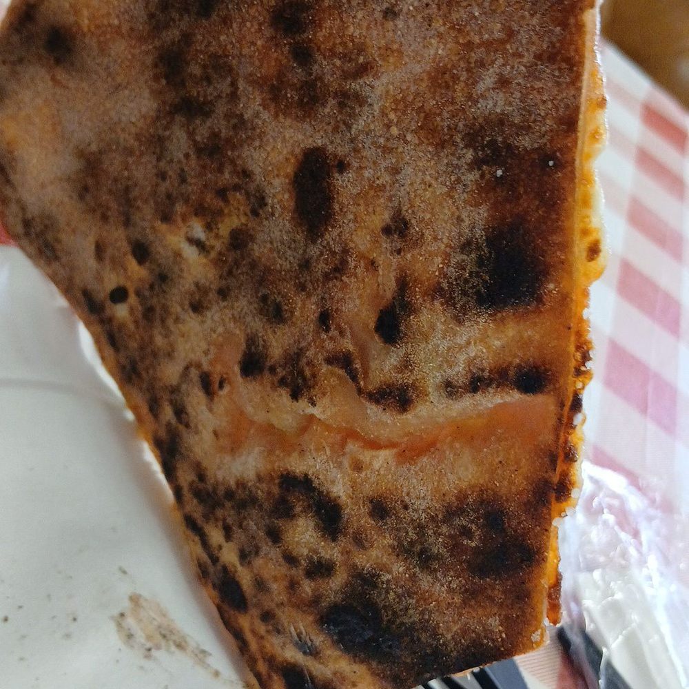 The Slice Spot - Bottom of Vege pizza slice, a bit on charred side, which gave off burnt taste - Pizza Near Me - West Chicago, Illinois The Slice Spot - Bottom of Vege pizza slice, a bit on charred side, which gave off burnt taste - Pizza Near Me - West Chicago, Illinois