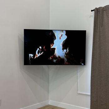 Grindlex Home Services - 65 in. tv on corner wall with hidden cords. - Handyman Near Me Grindlex Home Services - 65 in. tv on corner wall with hidden cords. - Handyman Near Me
