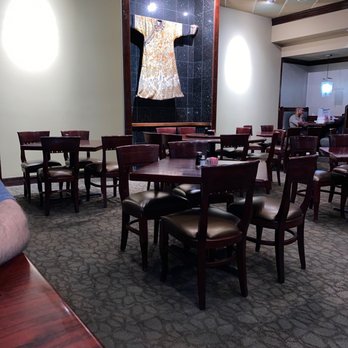 Five Happiness - a man sitting at a table in a restaurant - Chinese Near Me - New Orleans, Louisiana Five Happiness - a man sitting at a table in a restaurant - Chinese Near Me - New Orleans, Louisiana