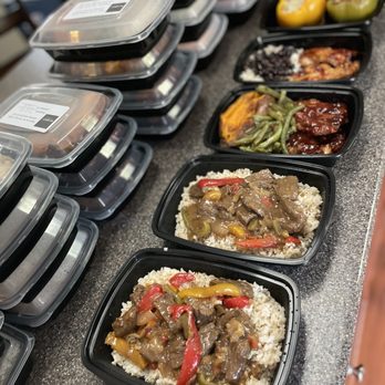 Phillips Humble Catering - a variety of food in plastic containers - Caterers Near Me Phillips Humble Catering - a variety of food in plastic containers - Caterers Near Me