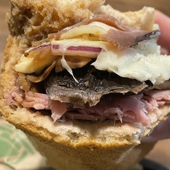 Cheba Hut Toasted Subs - a hand holding a sandwich - Bars Near Me - Austin, Texas Cheba Hut Toasted Subs - a hand holding a sandwich - Bars Near Me - Austin, Texas