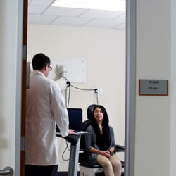 Alex Daniel Sweeney, MD - Dr. Alex Sweeney greeting a patient in clinic.